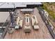 Beautiful rooftop deck with comfortable lounge seating and a dining area, perfect for outdoor entertaining at 2787 La Bella Ct, Henderson, NV 89052
