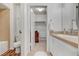 Bright bathroom with a shower-tub, and vanity with a sink, and a view into the walk-in closet at 3125 N Buffalo Dr # 1091, Las Vegas, NV 89128