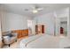 Spacious bedroom featuring a ceiling fan, comfortable seating, and ample storage at 3125 N Buffalo Dr # 1091, Las Vegas, NV 89128