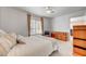 Airy bedroom with neutral tones, a window view, and a comfortable, plush bed at 3125 N Buffalo Dr # 1091, Las Vegas, NV 89128