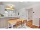 Eat-in kitchen boasts counter seating, modern appliances, and charming decor at 3125 N Buffalo Dr # 1091, Las Vegas, NV 89128