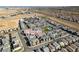 An aerial view of the community of new homes with shared pool, desert landscaping and stunning city views at 3217 Bertonico Ave, Henderson, NV 89044