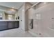 Bathroom with tile shower, glass doors, and storage at 3217 Bertonico Ave, Henderson, NV 89044