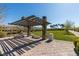 Shaded outdoor seating area with benches overlooking the lawns and greenbelts at 3217 Bertonico Ave, Henderson, NV 89044