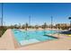 Outdoor pool featuring a large deck with lounge chairs and umbrellas at Inspirada at 3217 Bertonico Ave, Henderson, NV 89044