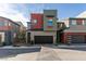 A modern two-story home with a two-car garage showcasing its unique contemporary design and curb appeal at 3217 Bertonico Ave, Henderson, NV 89044