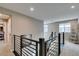 Second floor hallway with steel railing and lots of natural light at 3217 Bertonico Ave, Henderson, NV 89044
