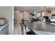 Kitchen flows into living area, promoting seamless entertaining with table and seating at 3217 Bertonico Ave, Henderson, NV 89044