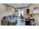 Functional home office featuring a comfortable couch, desk, and organized workspace at 3217 Bertonico Ave, Henderson, NV 89044