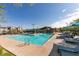 Enjoy the Community Pool on a clear day with lounge chairs and shaded seating for relaxation and fun at 3217 Bertonico Ave, Henderson, NV 89044
