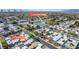 An elevated view showing homes and community areas including a tennis court and a pool at 3371 Royce Ct, Las Vegas, NV 89121