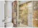 Bathroom with a tile shower, toilet, and glass shower door at 3371 Royce Ct, Las Vegas, NV 89121