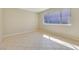 Bedroom with tiled floors and natural lighting at 3371 Royce Ct, Las Vegas, NV 89121