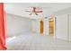 Bright primary bedroom with tile flooring, closet space, ceiling fan and easy access to attached bathroom at 3371 Royce Ct, Las Vegas, NV 89121