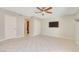 Bedroom with tile flooring, fan, closet and bathroom access, perfect for relaxation and privacy at 3371 Royce Ct, Las Vegas, NV 89121
