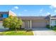 Charming single-story home with a well-maintained lawn, tree and an attached two-car garage at 3371 Royce Ct, Las Vegas, NV 89121