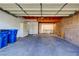 Well-lit garage space with built-in storage shelves and an exterior door at 3371 Royce Ct, Las Vegas, NV 89121