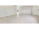 Bright living room featuring tile flooring, neutral walls, and a door leading to the outside at 3371 Royce Ct, Las Vegas, NV 89121