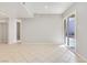 Large living room with sliding glass doors to the outside and tile flooring at 3371 Royce Ct, Las Vegas, NV 89121