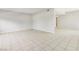 A spacious living area with tile flooring, neutral paint, and a visible hallway entrance at 3371 Royce Ct, Las Vegas, NV 89121