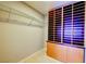 Walk-in closet with storage shelves and cabinets at 3371 Royce Ct, Las Vegas, NV 89121