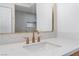 Bathroom featuring a quartz countertop, modern fixtures, and a large mirror at 3409 El Cortez Ave, Las Vegas, NV 89102