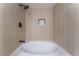 Bathroom showcasing a soaking tub with tiled walls and recessed shower niche at 3409 El Cortez Ave, Las Vegas, NV 89102