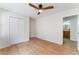 Bedroom with a ceiling fan and modern flooring, leading into an en-suite bathroom at 3409 El Cortez Ave, Las Vegas, NV 89102