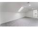 An airy bedroom with soft carpet, a modern skylight, and an entrance to an adjoining room at 3409 El Cortez Ave, Las Vegas, NV 89102