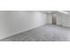 Spacious bedroom with soft carpet, clean white walls, and access to an adjacent room at 3409 El Cortez Ave, Las Vegas, NV 89102