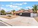Attractive single-story house with a dark garage door, complemented by palm trees at 3409 El Cortez Ave, Las Vegas, NV 89102