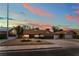 Charming single-story home featuring desert landscaping, mature trees, and a two-car garage at 3409 El Cortez Ave, Las Vegas, NV 89102
