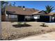 Inviting single-story home with a gravel yard, dark accents, and a well-maintained landscape at 3409 El Cortez Ave, Las Vegas, NV 89102