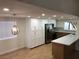 Bright kitchen featuring white cabinetry, stainless steel appliances, and breakfast bar at 3409 El Cortez Ave, Las Vegas, NV 89102