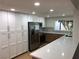 Bright kitchen featuring white cabinetry, stainless steel appliances, and quartz countertops at 3409 El Cortez Ave, Las Vegas, NV 89102