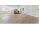Bright, open living room featuring wood floors and access to the kitchen and backyard at 3409 El Cortez Ave, Las Vegas, NV 89102