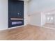 Bright, open living room features modern fireplace, wood floors, and high ceilings at 3409 El Cortez Ave, Las Vegas, NV 89102