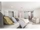 Comfortable main bedroom suite with stylish decor, a mirrored closet, barn door to the ensuite, and great natural light at 3409 El Cortez Ave, Las Vegas, NV 89102