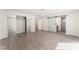 Large main bedroom with mirrored closet doors and a modern barn door to the bathroom, showcasing stylish modern design at 3409 El Cortez Ave, Las Vegas, NV 89102
