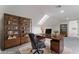 Bright home office featuring hardwood furnishings, a skylight, and a comfortable workspace at 3409 El Cortez Ave, Las Vegas, NV 89102