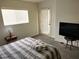 Comfortable bedroom with lots of natural light and a small side table at 3550 Bay Sands Dr # 2016, Laughlin, NV 89029