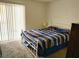 Comfortable bedroom featuring a double bed and a large sliding glass door at 3550 Bay Sands Dr # 2016, Laughlin, NV 89029