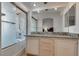 Bathroom featuring double sink, granite countertops, tub, shower and mirrored vanity at 3750 Horseshoe Mesa St, Las Vegas, NV 89147
