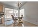 Dining area with access to outdoor patio through sliding glass door, with tile floors at 3750 Horseshoe Mesa St, Las Vegas, NV 89147