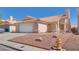 Charming single-story home featuring a two-car garage, desert landscaping, and a durable tile roof at 3750 Horseshoe Mesa St, Las Vegas, NV 89147