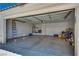 Spacious two car garage with door open and storage at 3750 Horseshoe Mesa St, Las Vegas, NV 89147