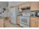 View of kitchen with stainless steel appliances, granite countertops, and tile floors at 3750 Horseshoe Mesa St, Las Vegas, NV 89147