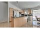 Bright kitchen with a center island, granite countertops, and stainless steel appliances at 3750 Horseshoe Mesa St, Las Vegas, NV 89147