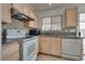 A well-lit kitchen features white appliances and granite countertops, with tile backsplash at 3750 Horseshoe Mesa St, Las Vegas, NV 89147