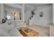 Bright and airy living room with tile floors, natural light, and a comfortable seating area at 3750 Horseshoe Mesa St, Las Vegas, NV 89147